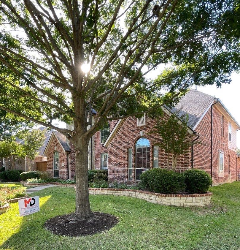 Image of a house in North Texas with the roof repaired by MD roofing and construction